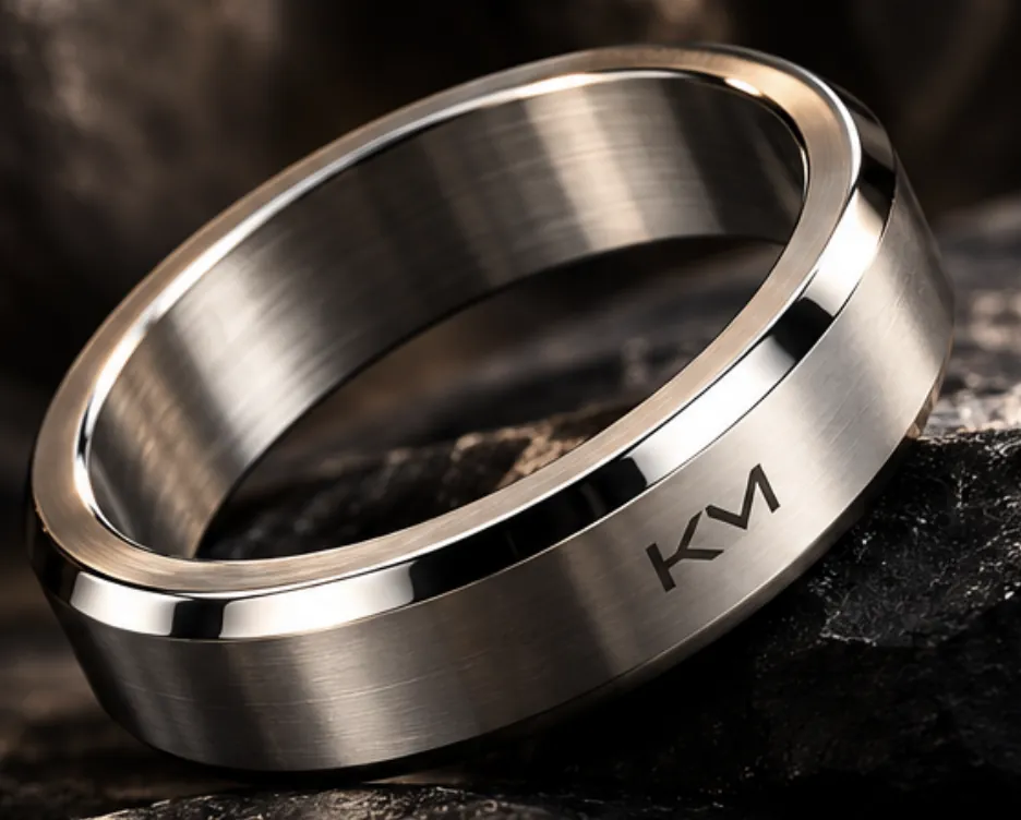 Docklands Band, brushed band with polished bevels and a KM mark, on dark rock (AI render)